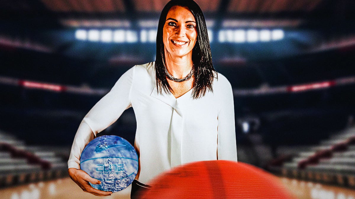 Utah State women's basketball head coach Kayla Ard with the ball freezing cold
