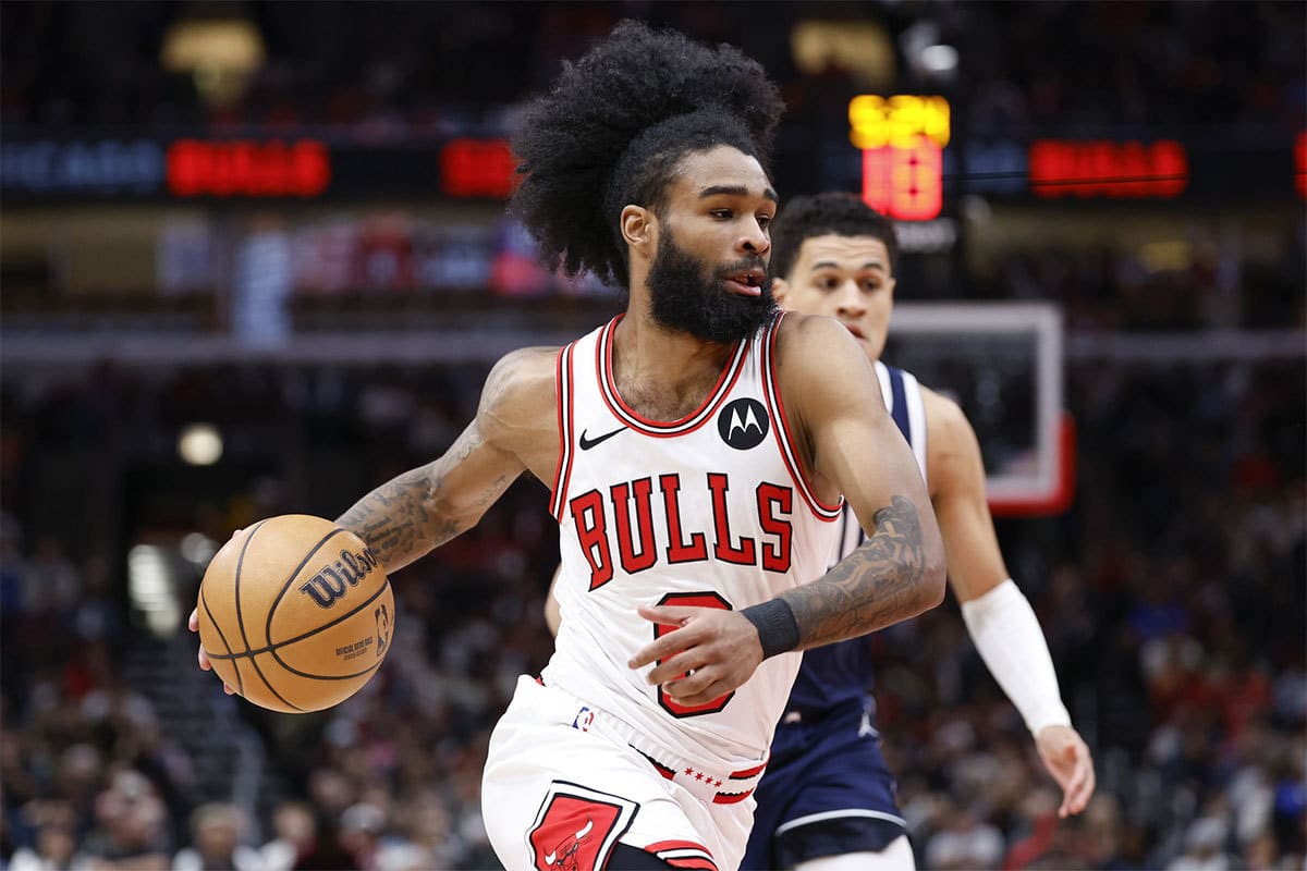 Chicago Bulls guard Coby White (0) drives to the basket against the Dallas Mavericks during the first half at United Center.