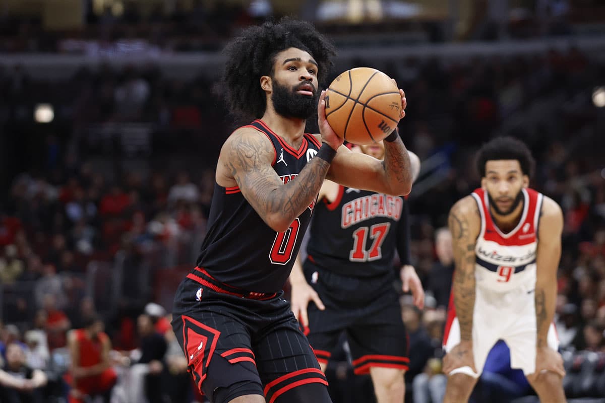 Chicago Bulls guard Coby White (0) shoots a free throw against the Washington Wizards during the first half at United Center.