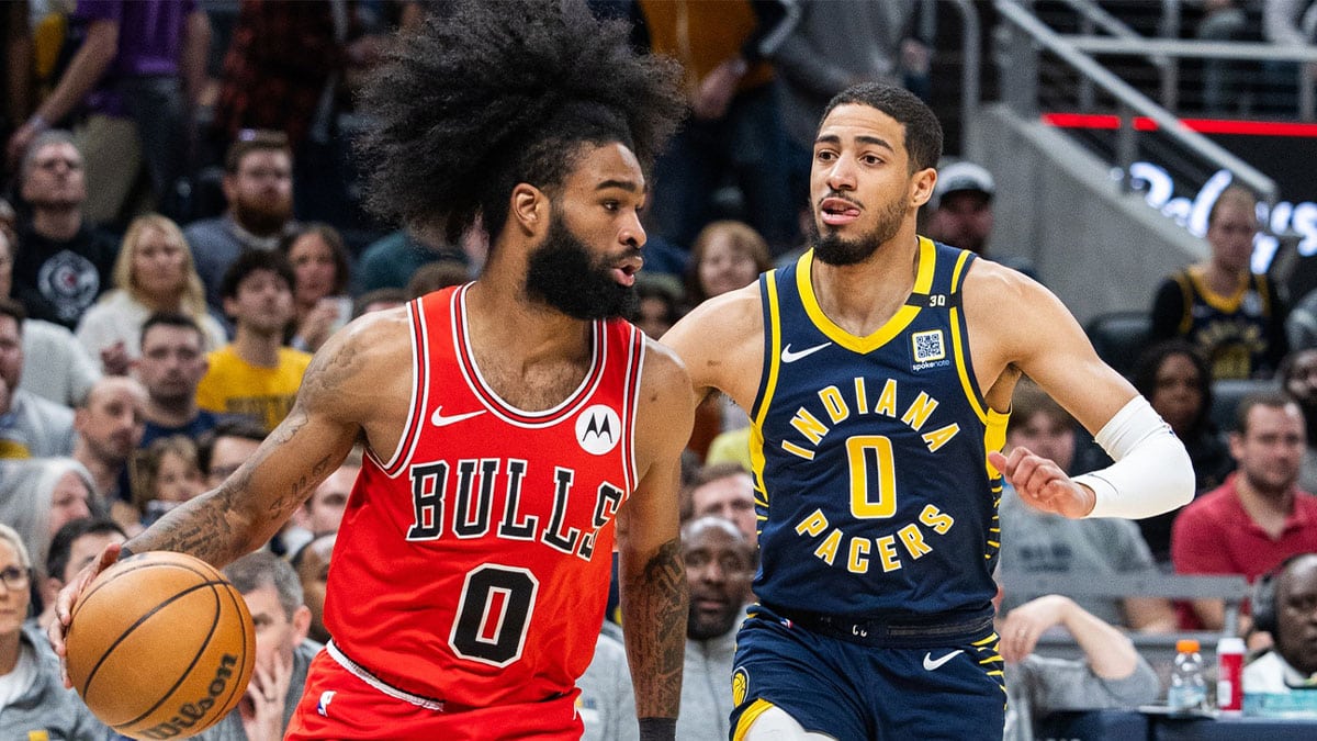 Chicago Bulls guard Coby White (0) dribbles the ball while Indiana Pacers guard Tyrese Haliburton (0) defends in the first half at Gainbridge Fieldhouse