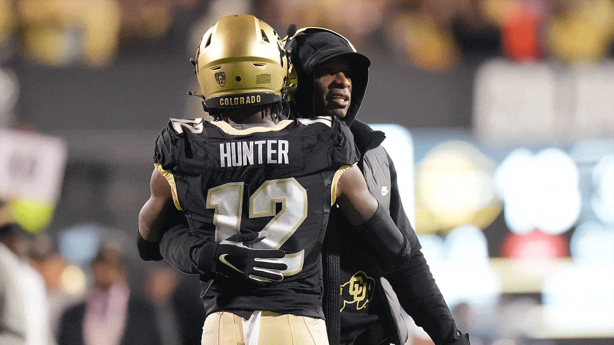 olorado Buffaloes wide receiver Travis Hunter (12) is congratulated for his touchdown by head coach Deion Sanders