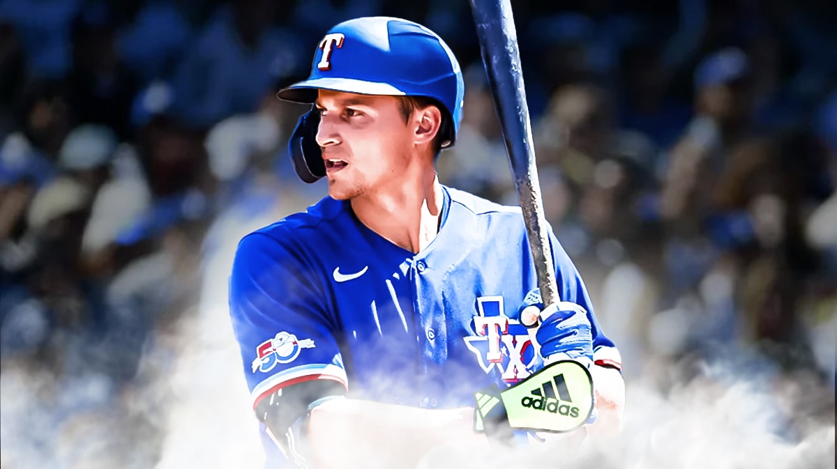 Rangers' Corey Seager swinging a baseball bat.