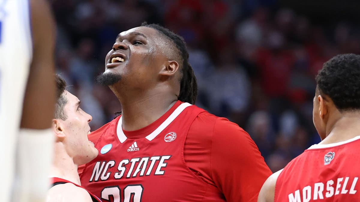 Mar 31, 2024; Dallas, TX, USA; North Carolina State Wolfpack forward DJ Burns Jr. (30) and guard Michael O'Connell (12) celebrate in the second half against the Duke Blue Devils in the finals of the South Regional of the 2024 NCAA Tournament at American Airline Center.