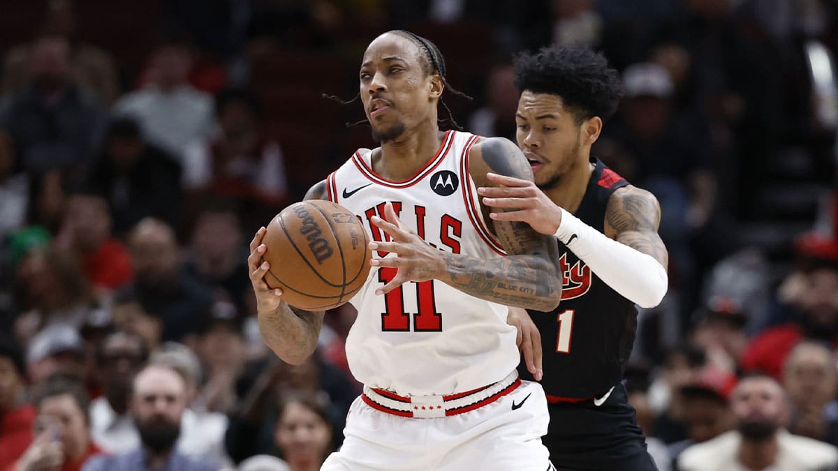 Chicago Bulls forward DeMar DeRozan (11) is defended by Portland Trail Blazers guard Anfernee Simons (1) during the second half at United Center.