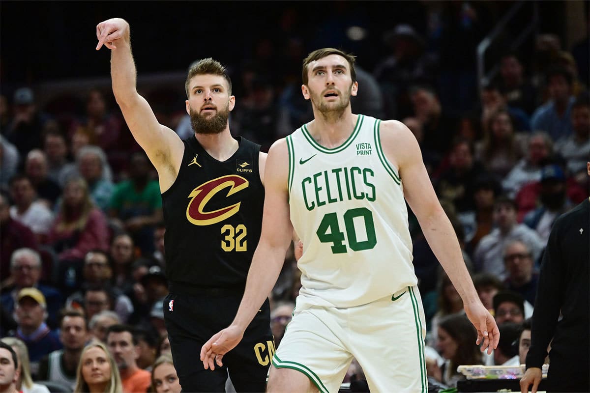 Cleveland Cavaliers forward Dean Wade (32) and Boston Celtics center Luke Kornet (40) watch as Wade makes a three point basket during the second half at Rocket Mortgage FieldHouse.