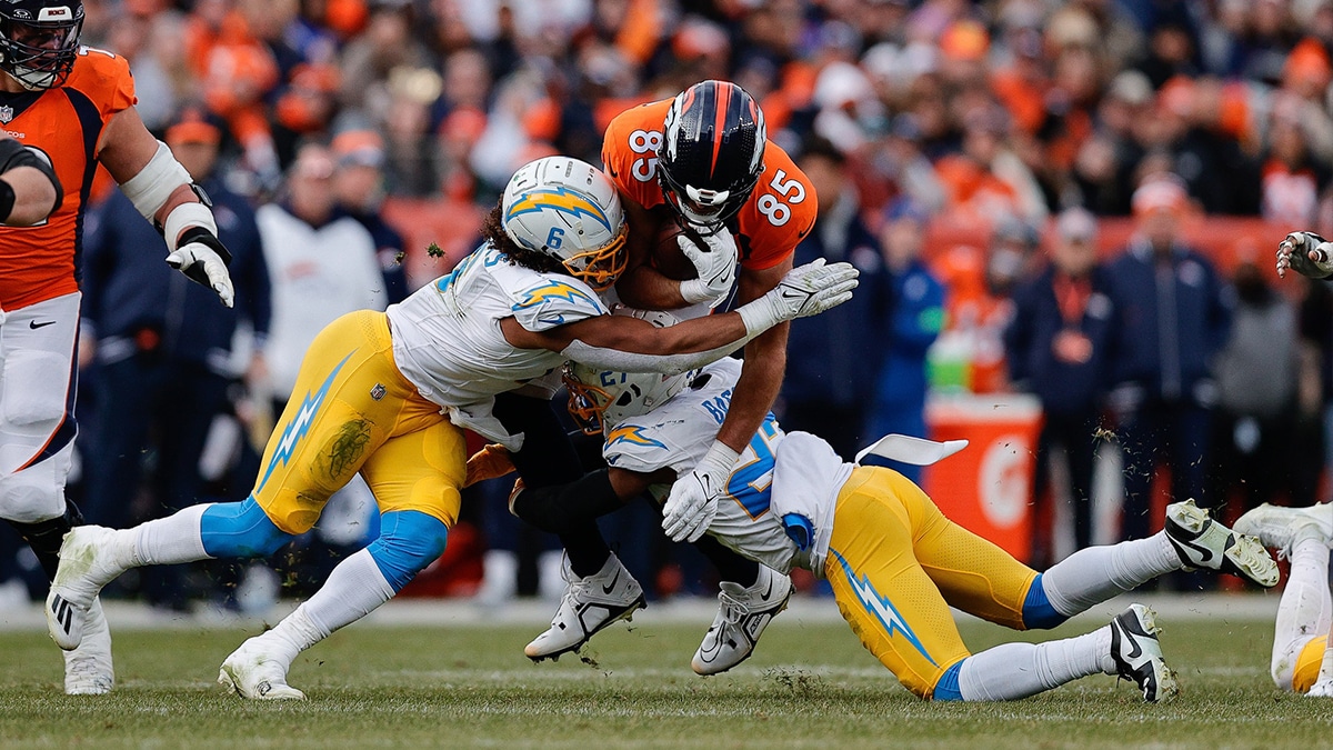 Denver Broncos tight end Lucas Krull (85) is tackled by Los Angeles Chargers linebacker Eric Kendricks (6)