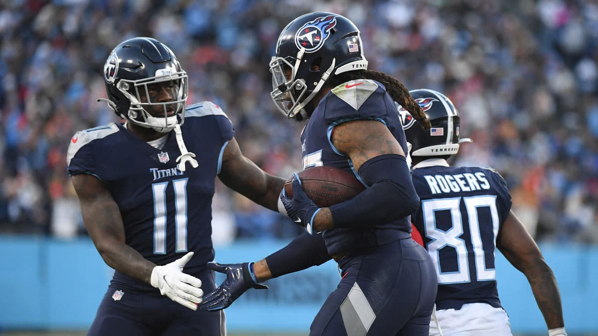 Tennessee Titans wide receiver A.J. Brown (11) celebrates with Tennessee Titans running back Derrick Henry (22) after a touchdown during the first half against the Cincinnati Bengals during a AFC Divisional playoff football game at Nissan Stadium.