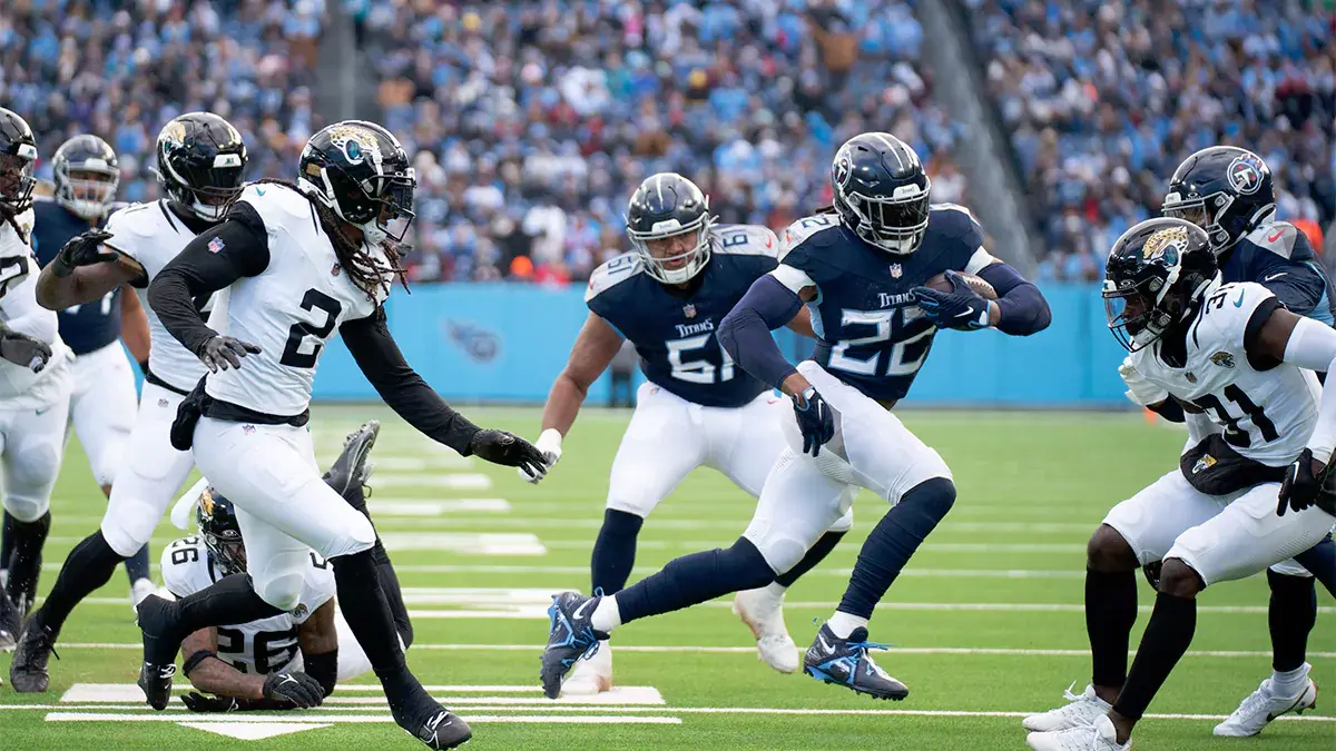 Tennessee Titans running back Derrick Henry (22) runs through the Jacksonville Jaguars defense for a touchdown in the second quarter of their game at Nissan Stadium