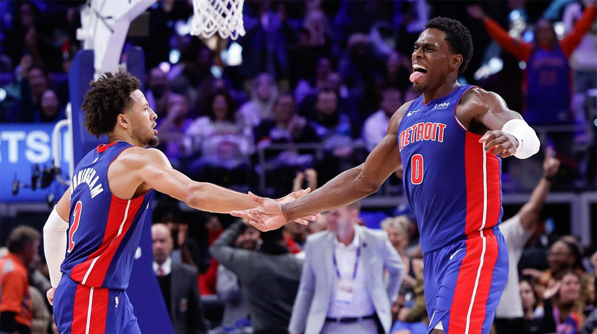 Detroit Pistons center Jalen Duren (0) celebrates with guard Cade Cunningham (2) after scoring in the second half against the Chicago Bulls at Little Caesars Arena.