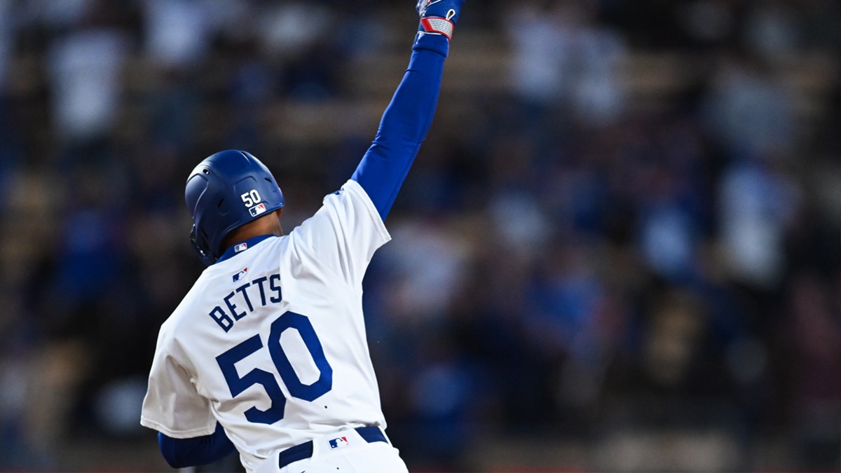 Los Angeles Dodgers second baseman Mookie Betts (50) reacts after hitting a home run against the St. Louis Cardinals during the first inning at Dodger Stadium.