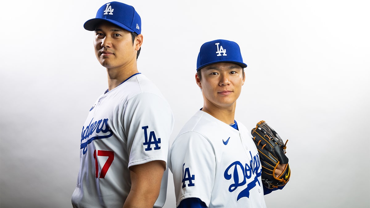 Los Angeles Dodgers designated hitter Shohei Ohtani (left) and pitcher Yoshinobu Yamamoto pose for a portrait during media day at Camelback Ranch.