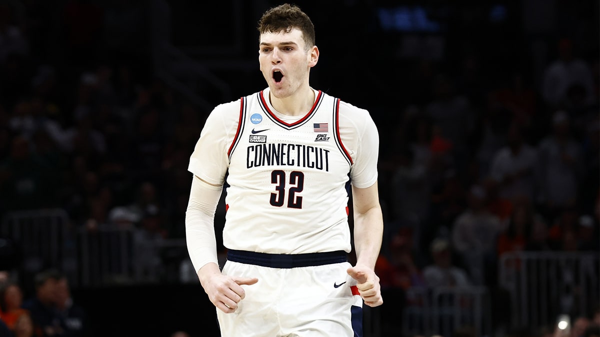  Connecticut Huskies center Donovan Clingan (32) reacts against the Illinois Fighting Illini in the finals of the East Regional of the 2024 NCAA Tournament at TD Garden.