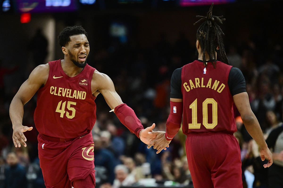 Cleveland Cavaliers guard Donovan Mitchell (45) celebrates with guard Darius Garland (10) during the second half against the Chicago Bulls at Rocket Mortgage FieldHouse