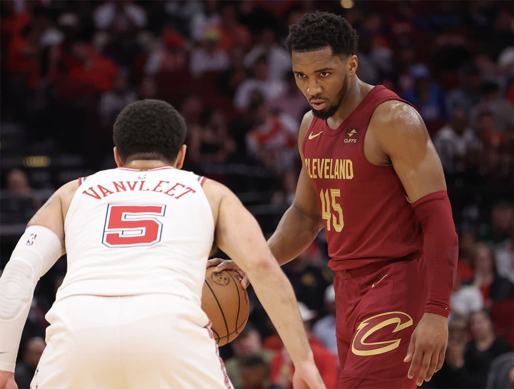 Cleveland Cavaliers guard Donovan Mitchell (45) dribbles against Houston Rockets guard Fred VanVleet (5) in the second half at Toyota Center.