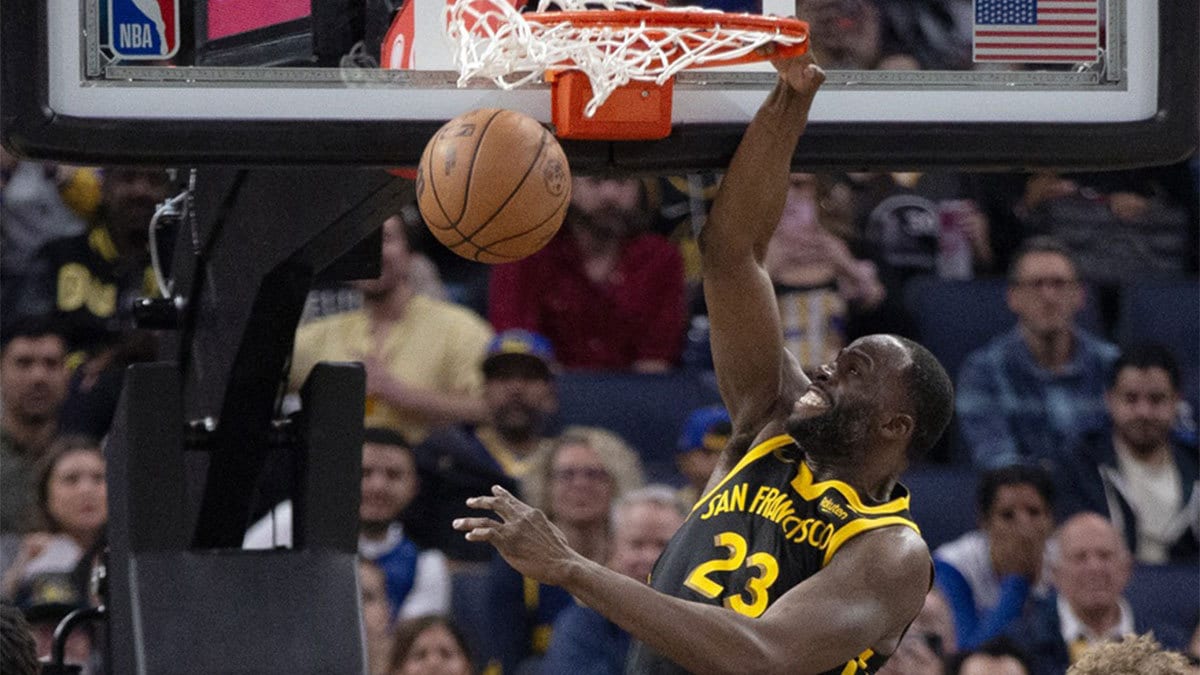 Golden State Warriors forward Draymond Green (23) dunks over Memphis Grizzlies guard Desmond Bane (22) during the third quarter at Chase Center.