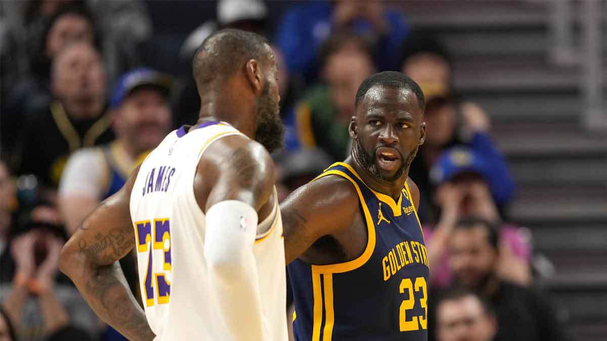 Golden State Warriors forward Draymond Green (right) talks with Los Angeles Lakers forward LeBron James (left) during the third quarter at Chase Center