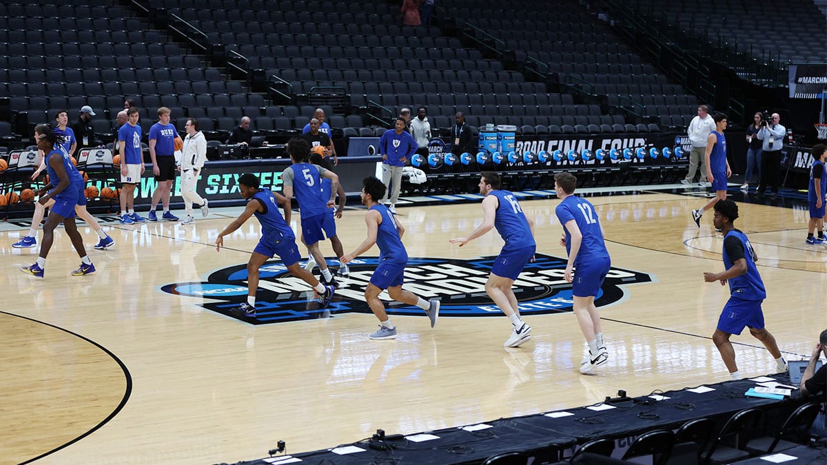 Duke Blue Devils players warm up during practice at American Airline Center.