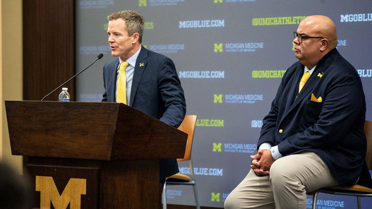 U-M's new men's basketball head coach Dusty May answers a question next to athletic director Warde Manuel speaks during an introductory press conference at Junge Family Champions Center 