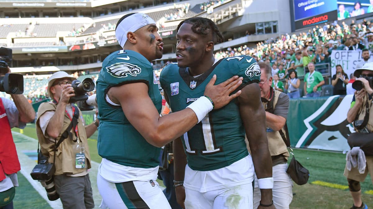 Philadelphia Eagles quarterback Jalen Hurts (1) and wide receiver A.J. Brown (11) walk off the field against the Washington Commanders at Lincoln Financial Field.