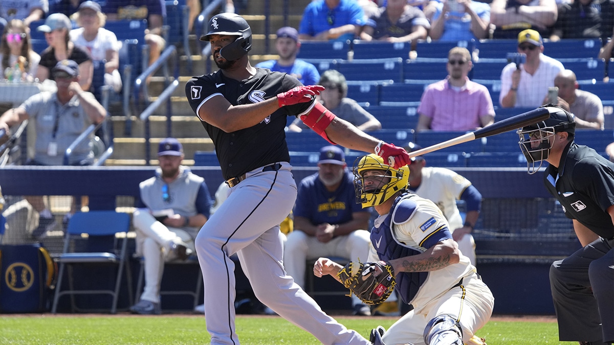 Chicago White Sox Eloy Jimenez (74) hits a two run double against the Milwaukee Brewers in the first inning at American Family Fields of Phoenix.