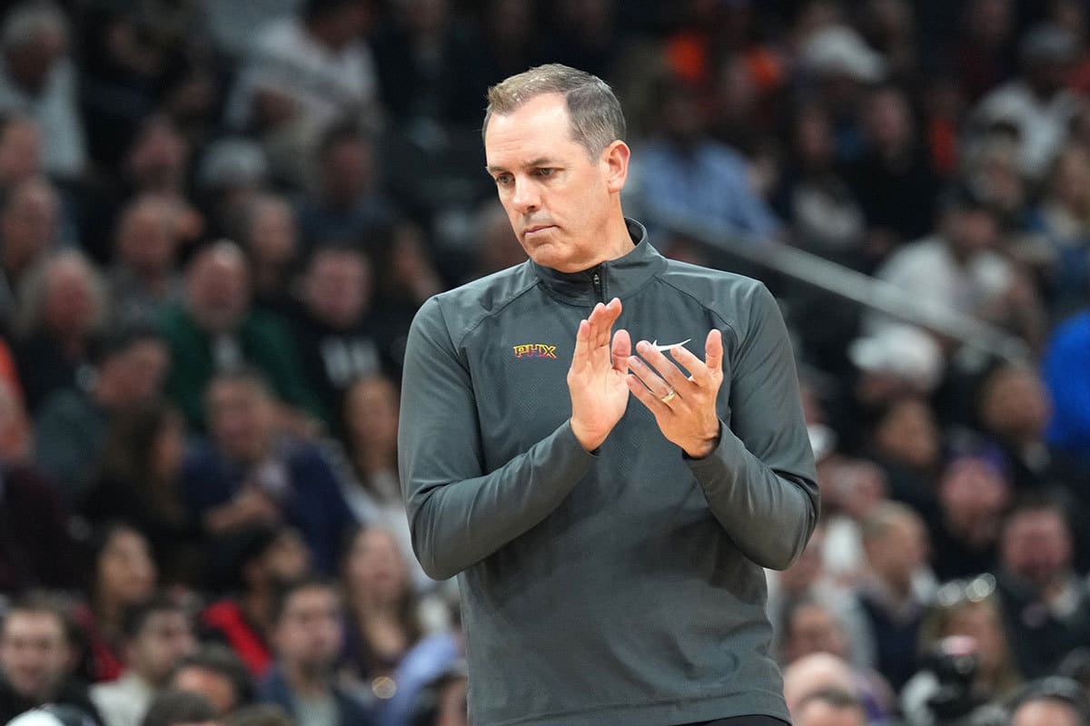 Phoenix Suns head coach Frank Vogel claps during the first half of the game against the Toronto Raptors at Footprint Center.