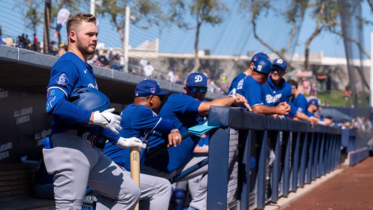 Los Angeles Dodgers infielder Gavin Lux (2) watches on from the dugout during a spring training game against the Milwaukee Brewers at American Family Fields of Phoenix.