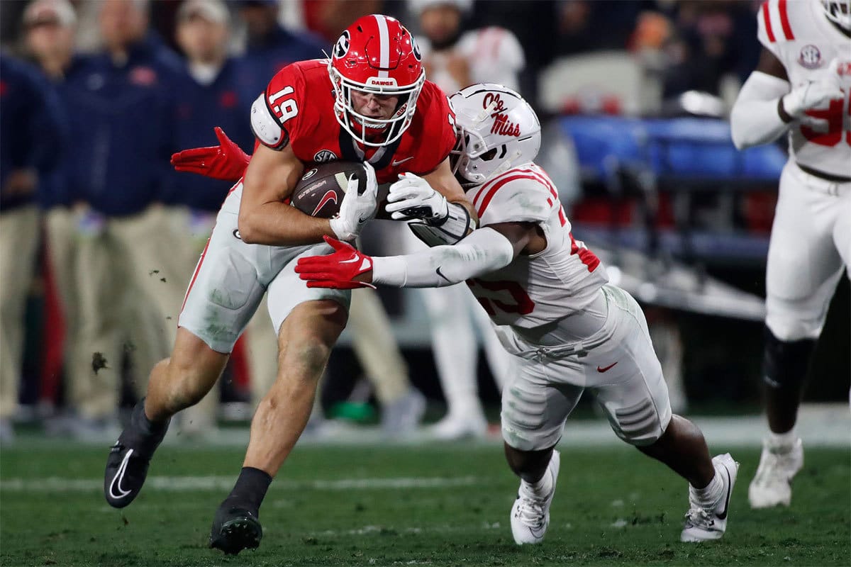 Georgia tight end Brock Bowers (19) competes with Ole Miss safety Trey Washington (25) during the first half of a NCAA college football game against Ole Miss in Athens, Ga., on Saturday, Nov. 11, 2023.