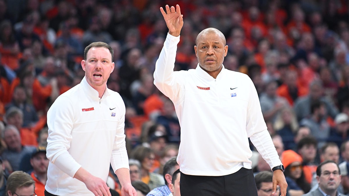 Syracuse Orange head coach Adrian Autry (right) and assistant coach Gerry McNamara react to a play against the Florida State Seminoles in the first half at the JMA Wireless Dome. 