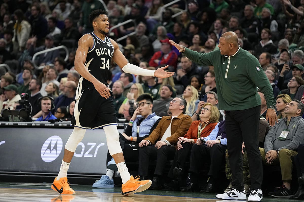 Milwaukee Bucks forward Giannis Antetokounmpo (34) is greeted by head coach Doc Rivers during the second quarter against the Philadelphia 76ers at Fiserv Forum.