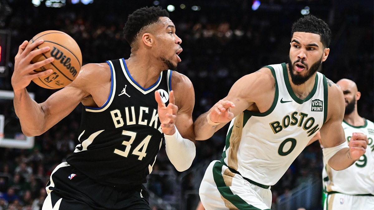 Milwaukee Bucks forward Giannis Antetokounmpo (34) drives for the basket against Boston Celtics forward Jayson Tatum (0) in the second quarter at Fiserv Forum.