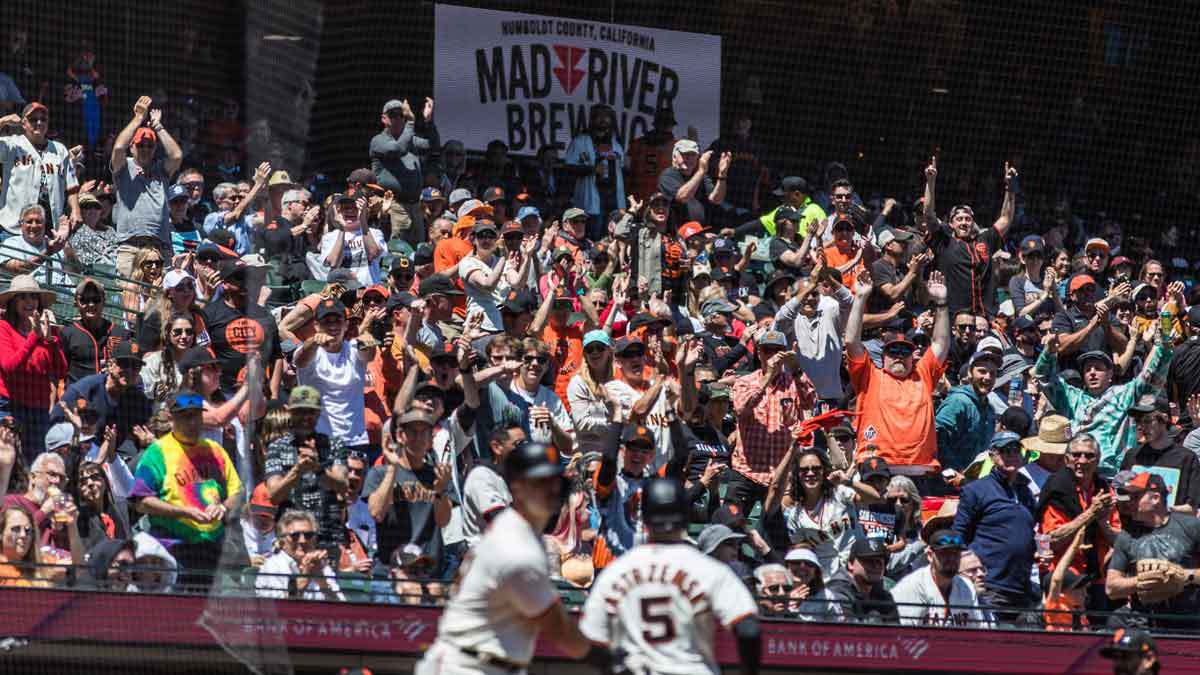 Fans cheer after San Francisco Giants center fielder Mike Yastrzemski (5) scored against the Colorado Rockies during the fourth inning at Oracle Park. 