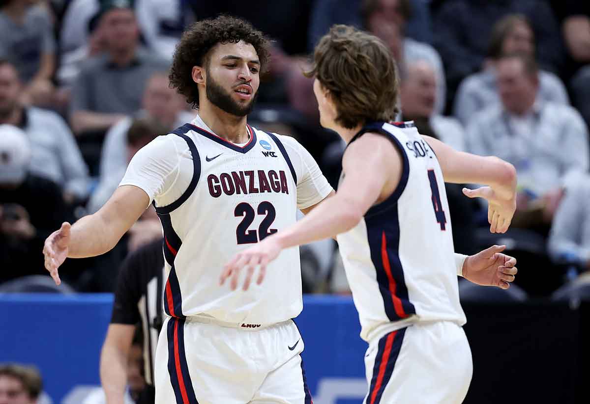 Gonzaga Bulldogs forward Anton Watson (22) celebrates with guard Dusty Stromer (4) during the first half in the first round of the 2024 NCAA Tournament against the McNeese State Cowboys at Vivint Smart Home Arena-Delta Center