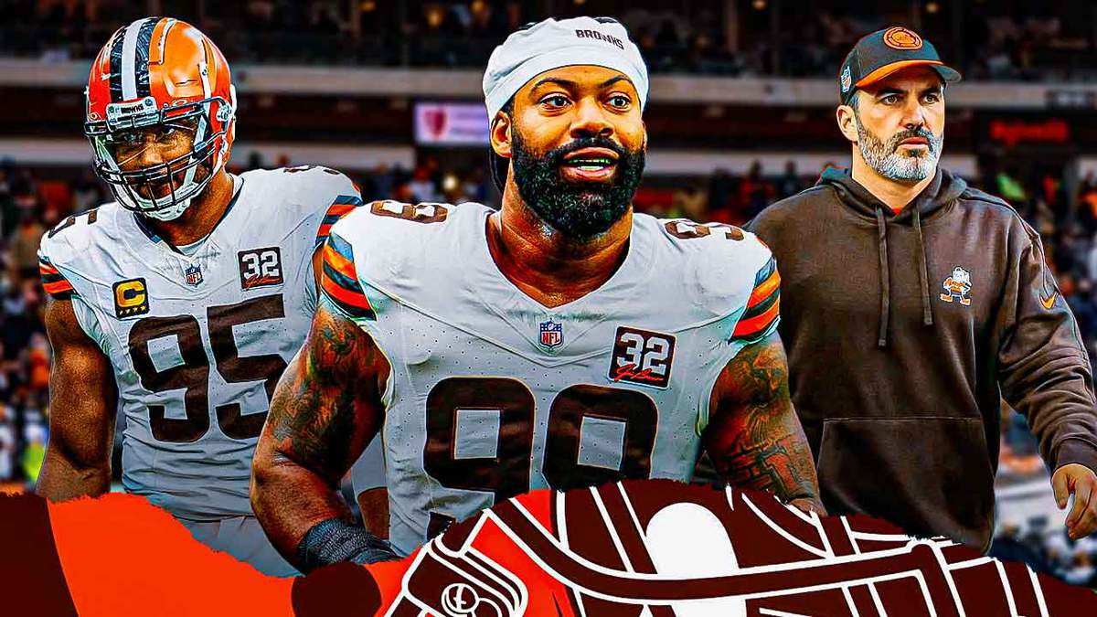 Coach Kevin Stefanski in the middle, Za'Darius Smith and Myles Garrett around him, and Cleveland Browns wallpaper in the background.