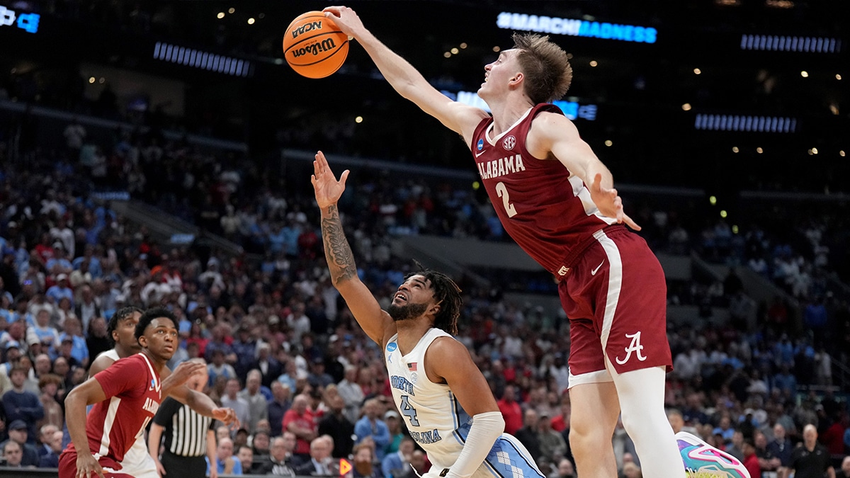 Alabama Crimson Tide forward Grant Nelson (2) blocks North Carolina Tar Heels guard RJ Davis (4) in the second half in the semifinals of the West Regional of the 2024 NCAA Tournament at Crypto.com Arena