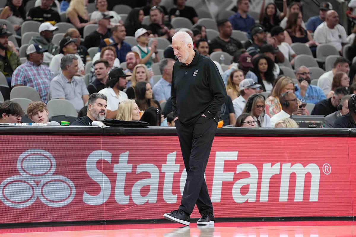 San Antonio Spurs head coach Gregg Popovich walks the sideline in the first half against the Memphis Grizzlies at Frost Bank Center.