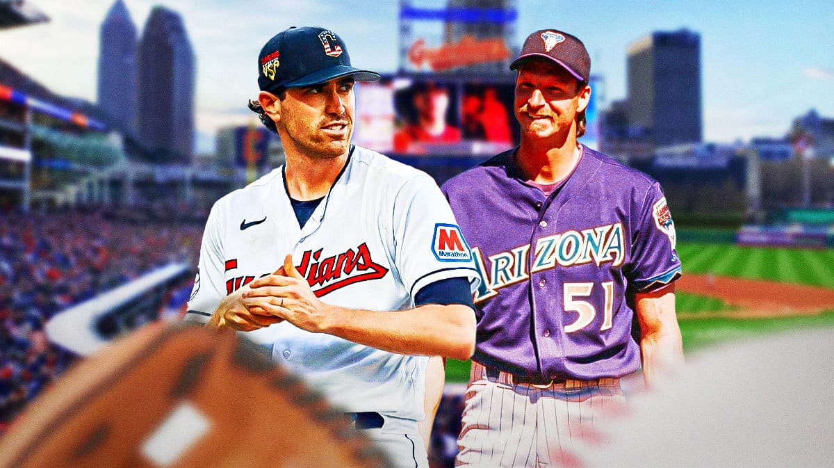 Guardians' Shane Bieber hyped up, with Diamondbacks' Randy Johnson (2001) smiling beside him