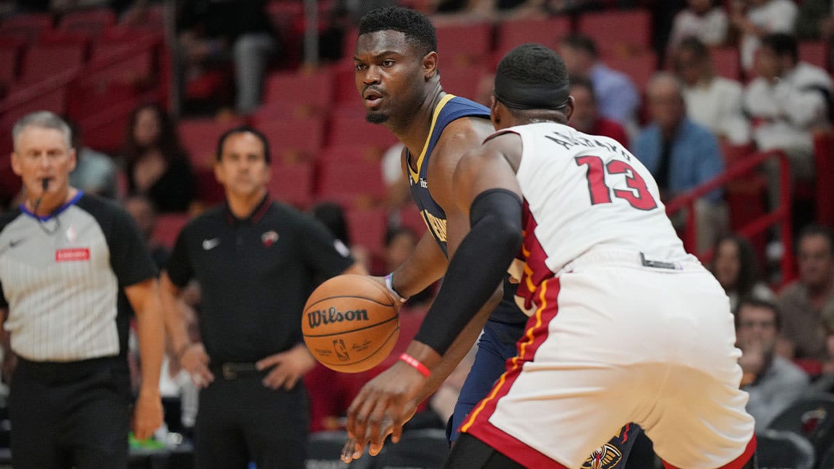 New Orleans Pelicans forward Zion Williamson (1) looks to pass the ball as Miami Heat center Bam Adebayo (13) defends during the first half at Kaseya Center. 