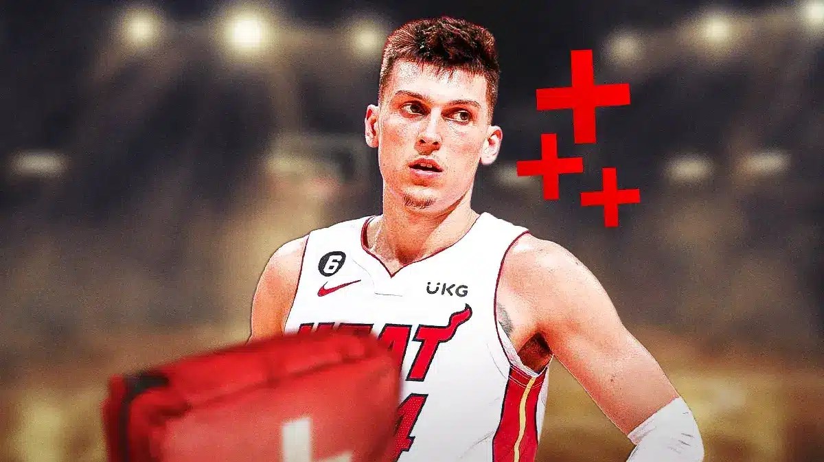 Miami Heat star Tyler Herro with injury signs around him in front of the Kaseya Center.