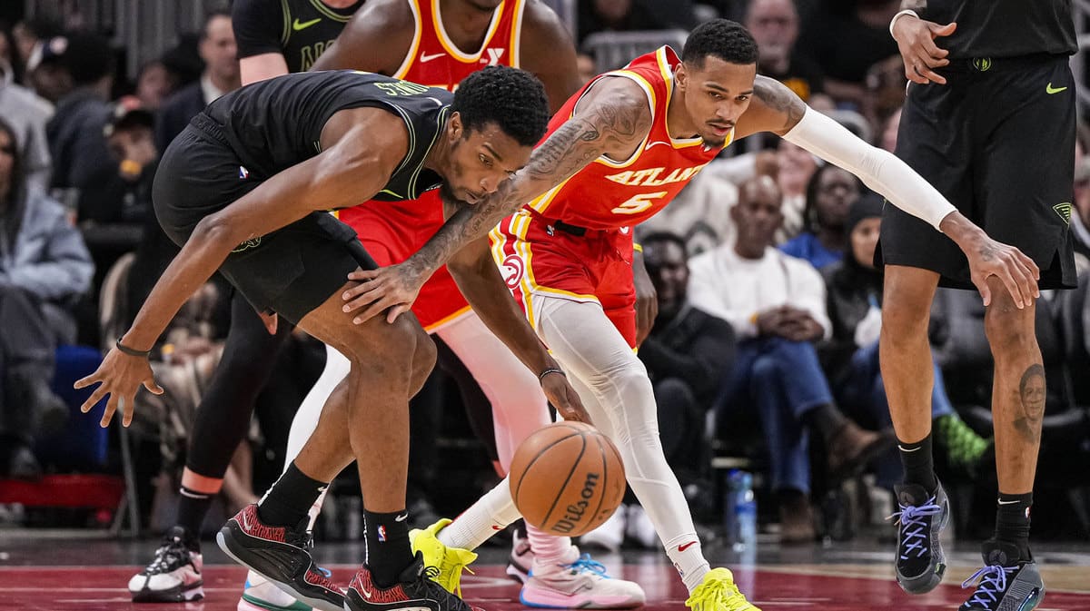 New Orleans Pelicans forward Herbert Jones (5) gets the ball away from Atlanta Hawks guard Dejounte Murray (5) during the second half at State Farm Arena