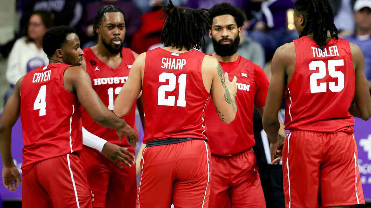 Houston Cougars guard L.J. Cryer (4) and Houston Cougars forward J'Wan Roberts (13) and Houston Cougars guard Emanuel Sharp (21) and Houston Cougars forward Joseph Tugler (25) and Houston Cougars guard Damian Dunn (11) react during the first half against the TCU Horned Frogs at Ed and Rae Schollmaier Arena