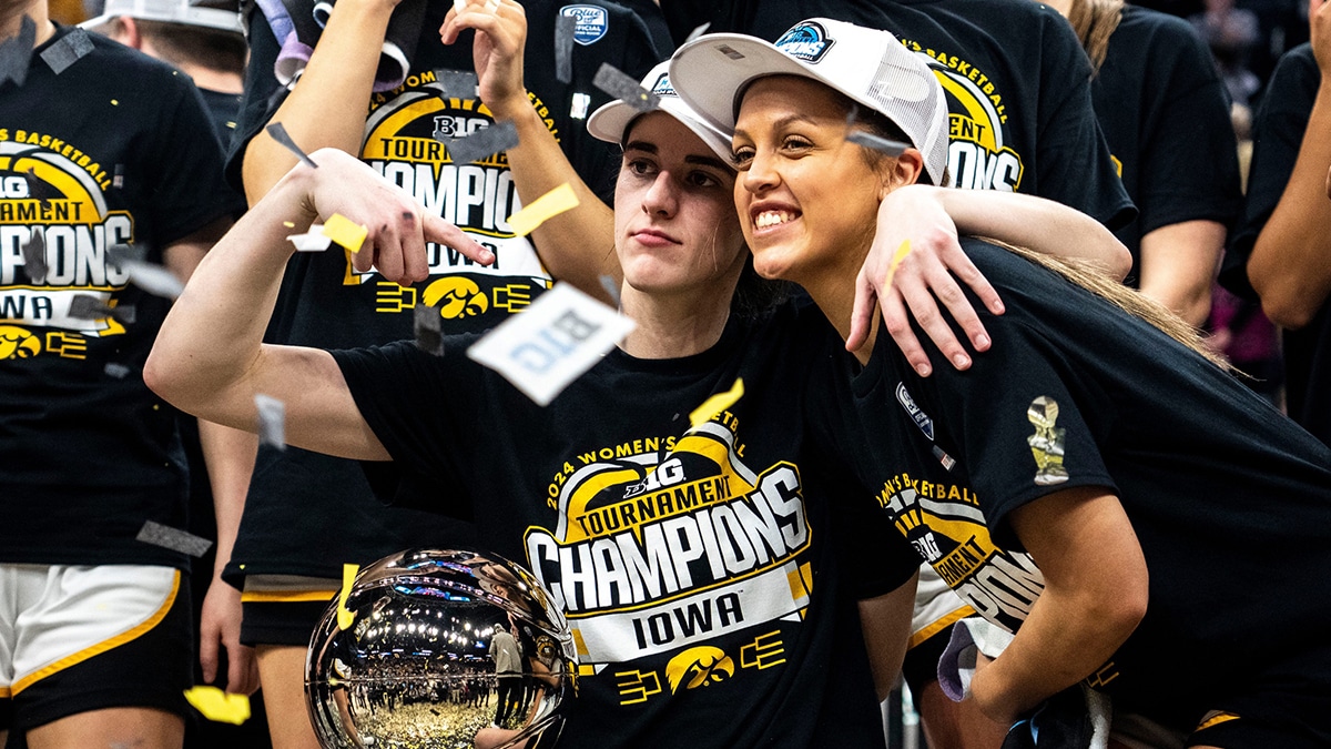 Iowa guard Caitlin Clark (22) reacts as confetti falls after Iowa wins the Big Ten Tournament championship game at the Target Center