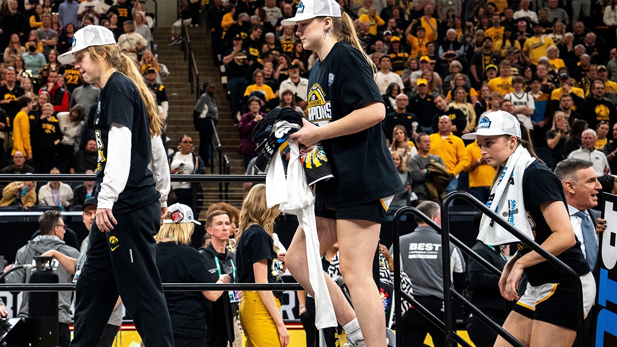 Iowa guard Molly Davis (1) walks onto the stage for the trophy presentation after the Big Ten Tournament championship game at the Target Center on Sunday, March 10, 2024, in Minneapolis, Minn.