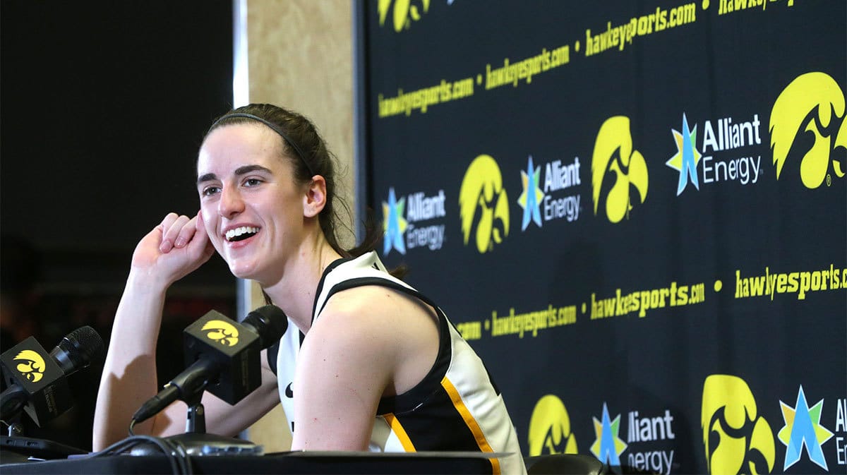 Iowa s Caitlin Clark (22) speaks to media after playing Ohio State
