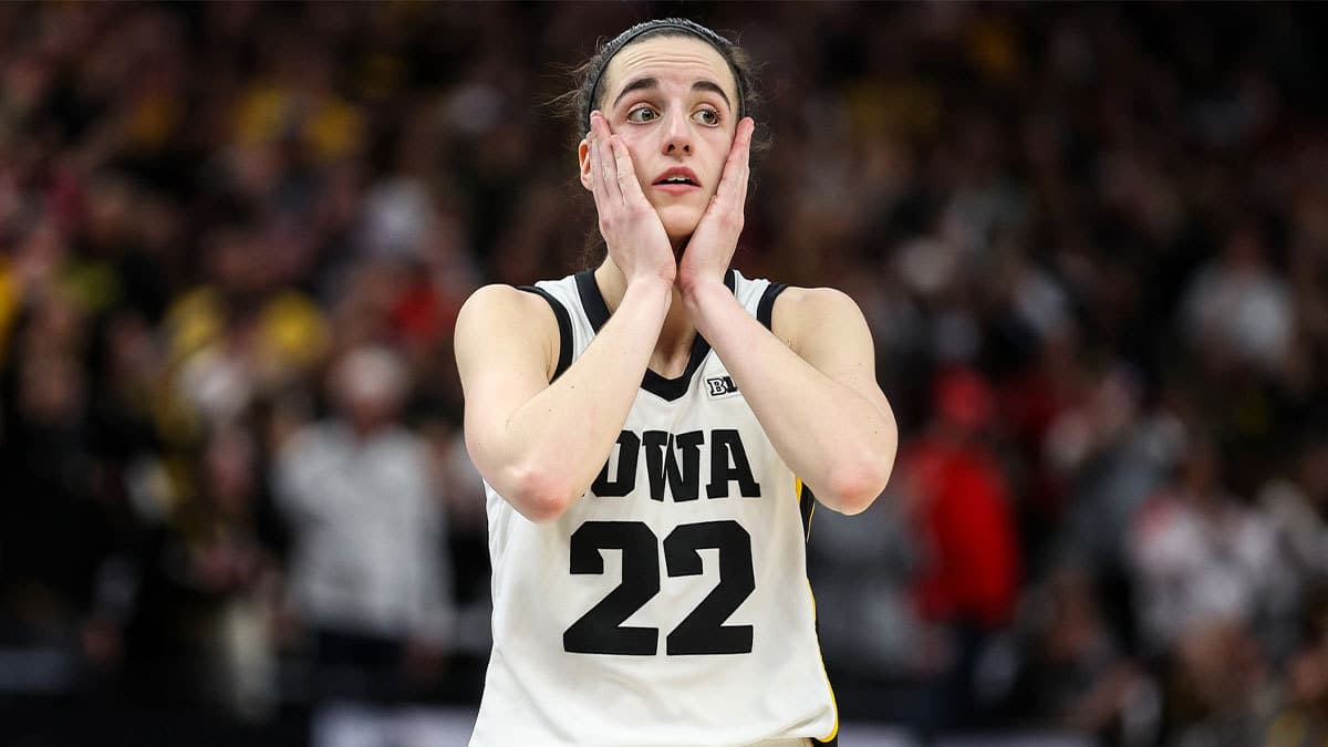 ; Iowa Hawkeyes guard Caitlin Clark (22) reacts to forward Hannah Stuelke's (45) free throw shots during overtime against the Nebraska Cornhuskers