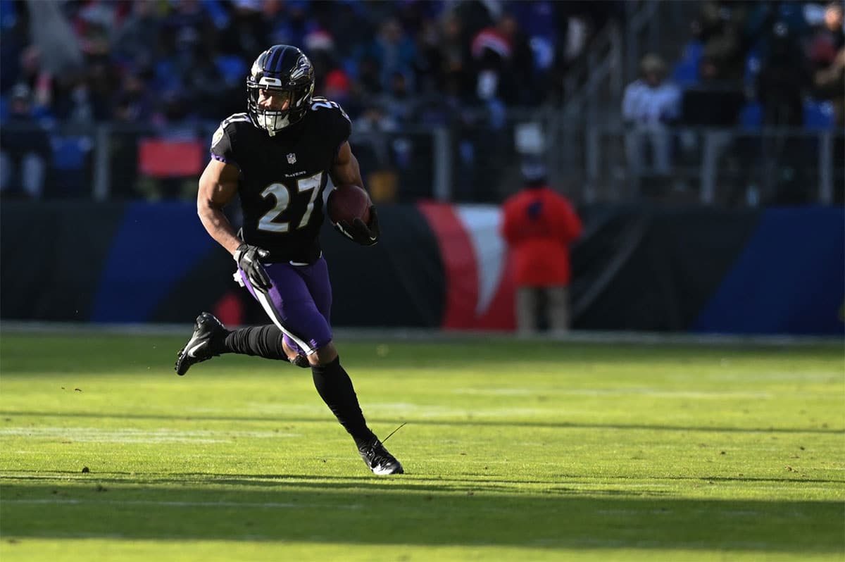 Baltimore Ravens running back J.K. Dobbins (27) rushes during the game against the Atlanta Falcons at M&T Bank Stadium.