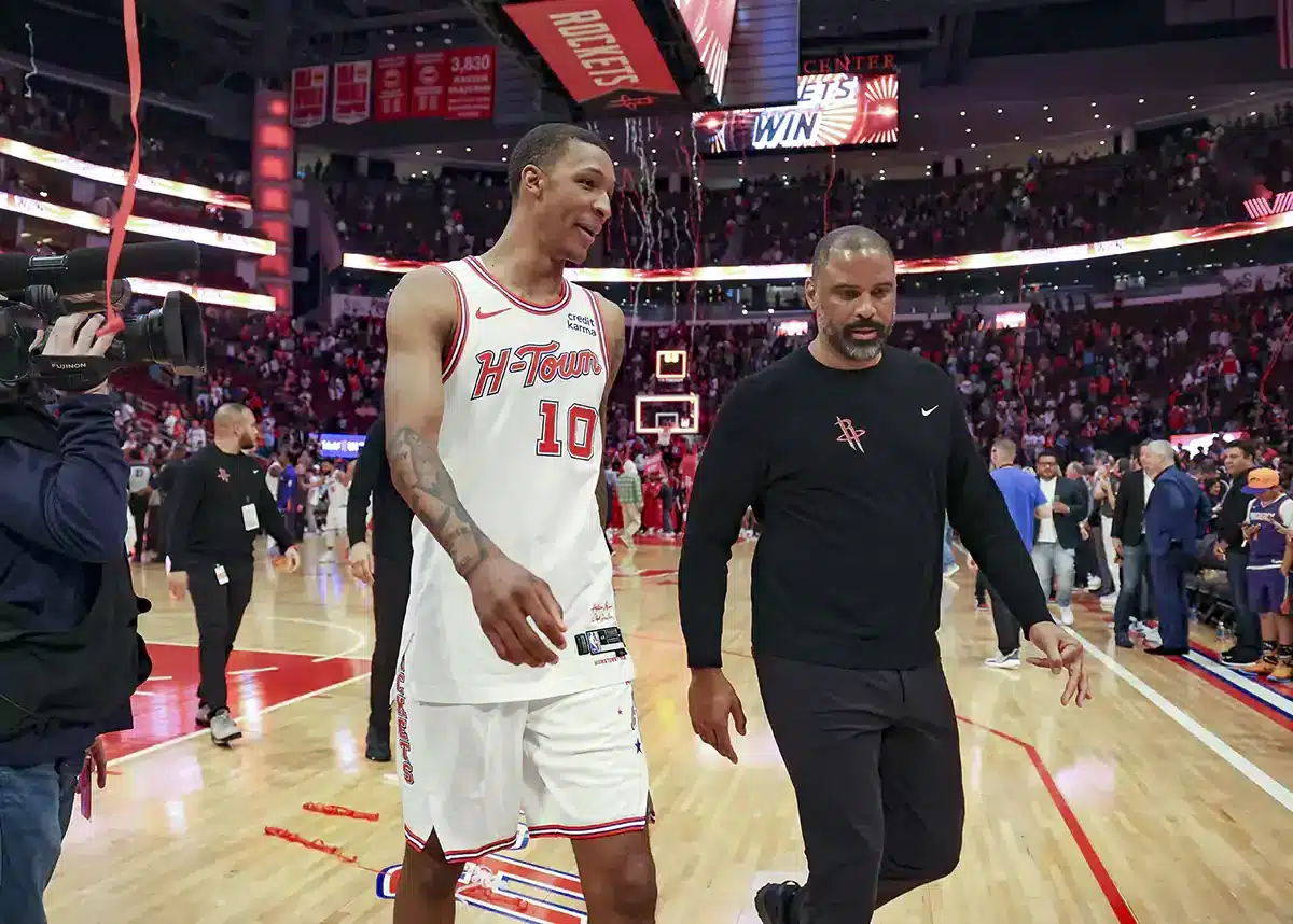 Houston Rockets forward Jabari Smith Jr. (10) and head coach Ime Udoka walk off the court after the game against the Phoenix Suns at Toyota Center. 