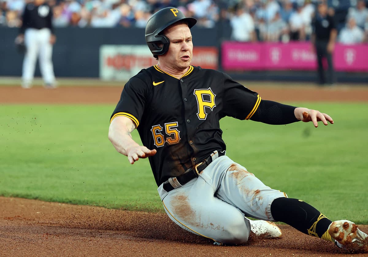 Pittsburgh Pirates center fielder Jack Suwinski (65) slides into third base against the New York Yankees during the first inning at George M. Steinbrenner Field.