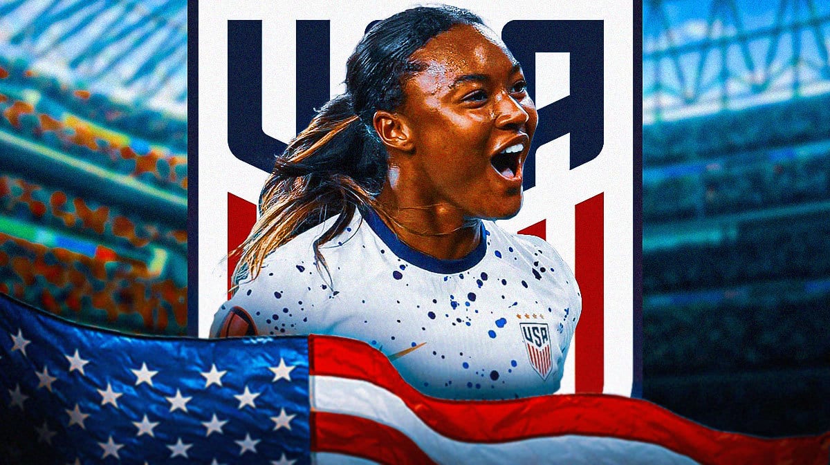 Jaedyn Shaw celebrating in front of the USWNT logo