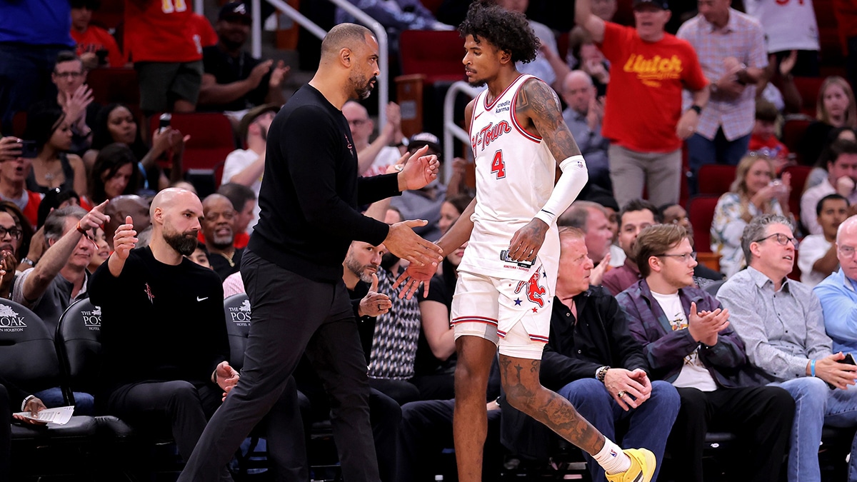 Houston Rockets guard Jalen Green (4) shakes hands with Houston Rockets head coach Ime Udoka after being taken out during the fourth quarter against the Utah Jazz at Toyota Center.