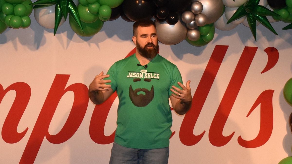 Retired Eagle Jason Kelce, wearing a shirt that promotes his Legend Edition Chunky soup can, addresses some 600 Campbell Soup Co. workers during a visit to the firm's Camden headquarters on March 20.